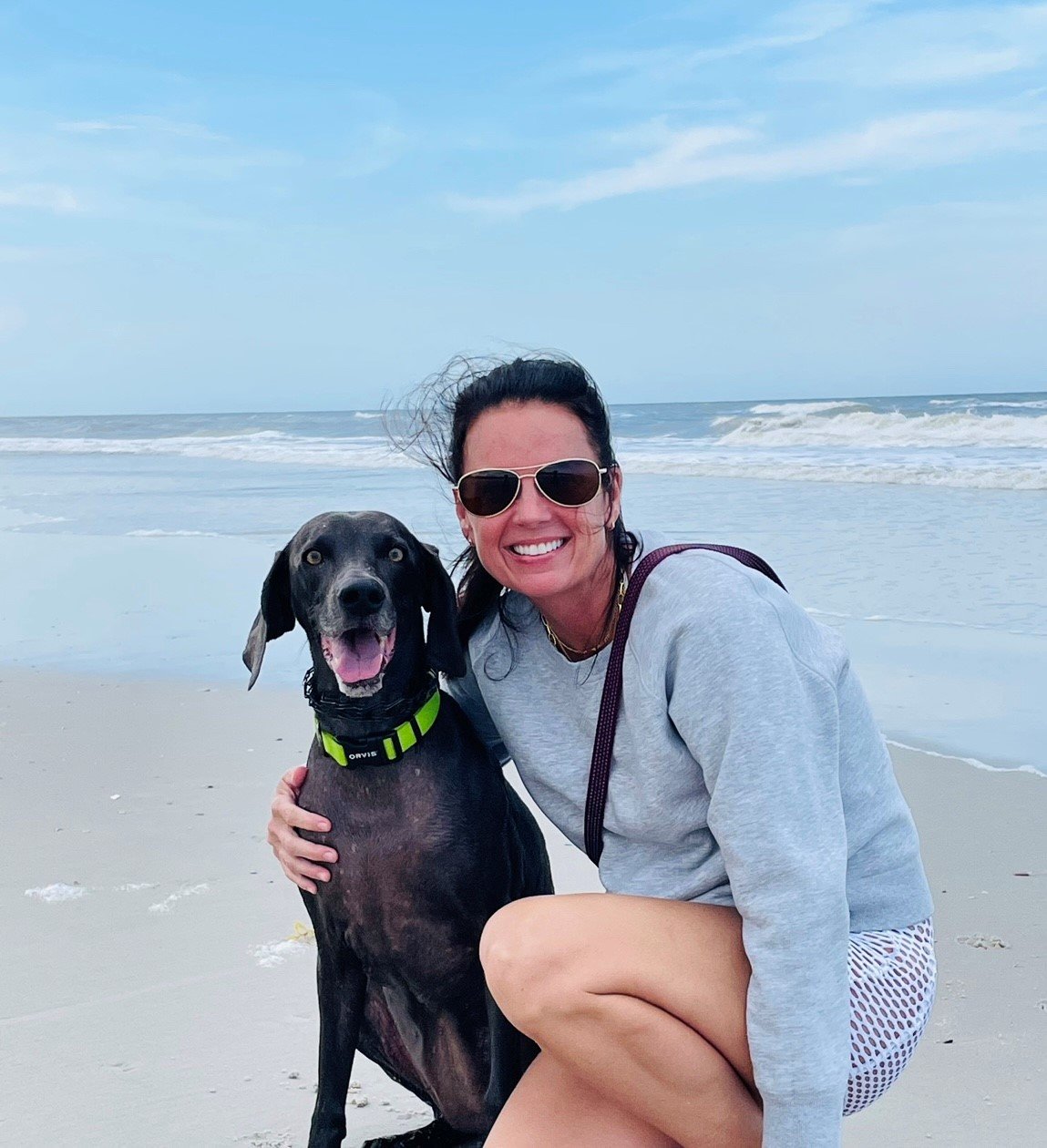 Kate Wagner with her Blue Weimaraner, Bella on the beach. The beach is one of Wagner’s favorite places.